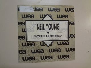 Neil Young: Rockin’ In The World 3:38 - Same - Spain 7 " 89 Wea 1.  254 Dj W/sl Dj