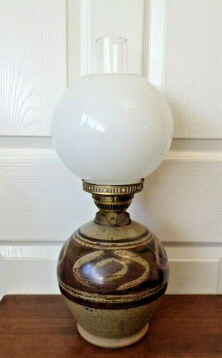 A Vintage Studio Pottery Oil Lamp With White Glass Globe Shade Order