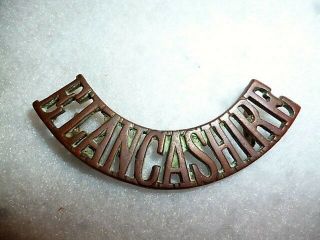 The East Lancashire Regiment Brass Shoulder Title Badge