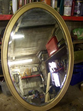 A Large Vintage Oval Mirror