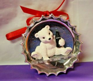 Coca - Cola Silver Bottle Cap Ornament With Baby Polar Bear Sitting Drinking Coke