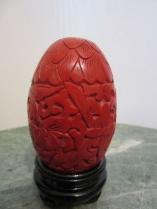 Chinese Red Cinnabar Carved Egg With Wooden Stand