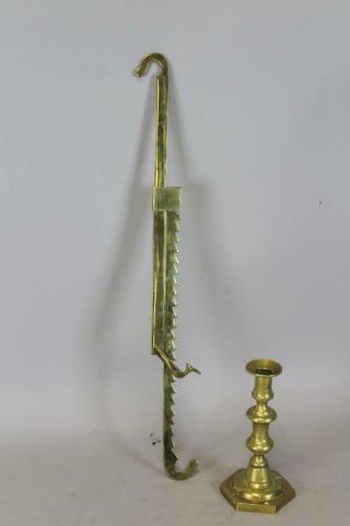 An Extremely Rare 18th C Brass Sawtooth Lighting Trammel With " Foot " Decoration