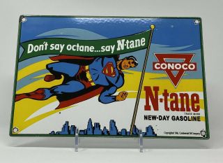 Vintage Conoco N - Tane Gasoline Porcelain Sign Superman Pump Plate Motor Oil