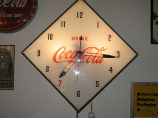 Coca Cola Pam Clock.  " Drink Coca Cola " Logo Diamond Shape.
