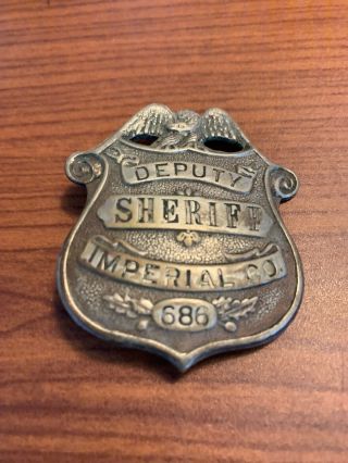 Vintage deputy sheriffs badge imperial County number 686 3