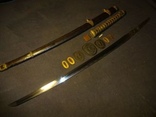 Japanese WWll Naval officer ' s sword in mountings,  hand forged 
