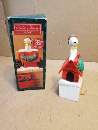 Snoopy On Dog House With Lighted Wreath Stocking Hanger ((