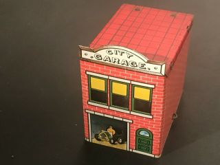 1914 West Bros.  Tin And Glass Candy Container Toy City Garage With Insert & Clip