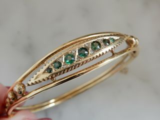 An Exceptional 9 Ct Gold Decorative Emerald And Diamond Bangle