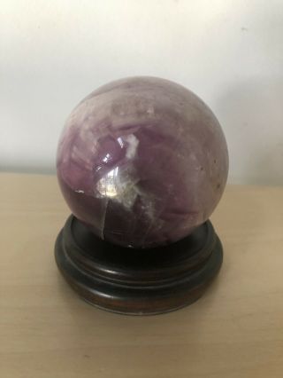 Highly Polished Blue Stone Sphere On Wooden Stand