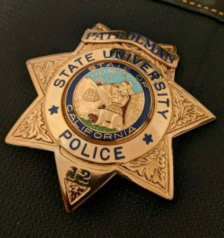 Old/obsolete California State University Police Badge