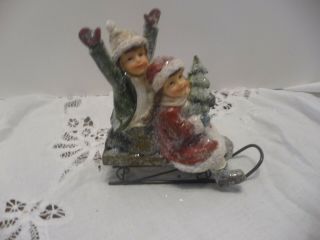 Victorian Christmas Figurine Girl And Boy On Sled With Snow