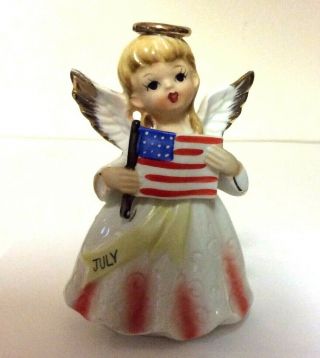 Vintage Ceramic Angel Figurine Girl Holding The American Flag Made In Japan