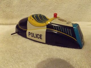 VINTAGE PRESSED STEEL - - 1950 ' s - - BATTERY OPERATED POLICE CAR - - TIN - - JAPAN - - PROJECT 2