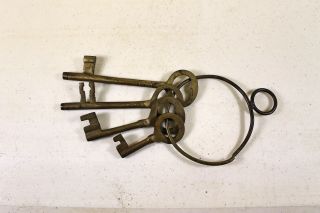 4 Vintage Brass Skeleton Keys On Brass Forged Ring