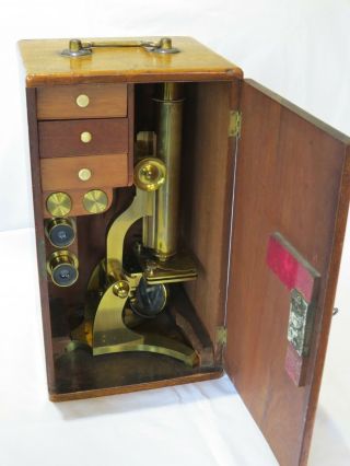 Antique brass microscope made by J White of Glasgow with lenses in case 2