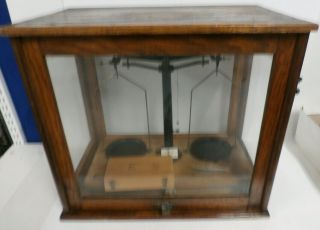 Balance Scale In Wood And Glass Display Case.