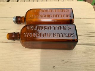 (two) Dr.  J.  Hostetter’s Stomachic (ic) Spelling,  Bitters Bottles.  Vintage