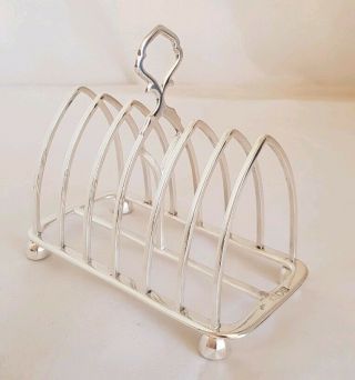Edwardian Sterling Silver Seven Bar Toast Rack.  London 1901.  By William Hutton