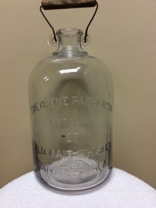 The Orene Parker Co.  Old Maid Whiskey Glass Jug Jar Covington,  Ky W/bail Handle