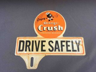 Old Enjoy Orange Crush Soda Drive Safely Crushy Mascot Ad License Plate Topper