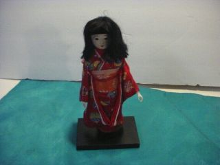 Vintage 7 1/2 " Geisha Girl Doll On Wooden Base.