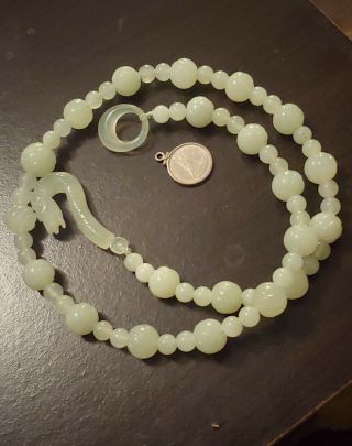 Vintage translucent jade beaded necklace with dragon clasp. 3