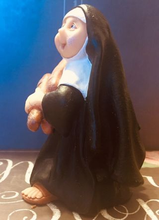 Polymer Clay Figurine: A Nun Carrying Her Loaves Of French Bread. 2