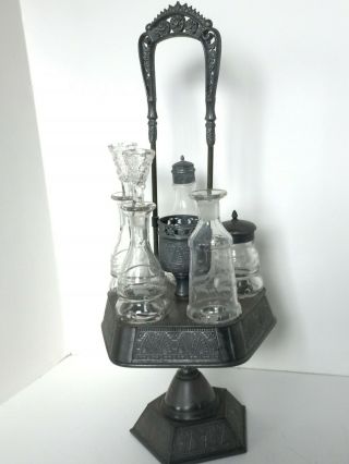 Antique Glass Castor Cruet Set - 5 Slot And Extra Slot In Center (very Old)