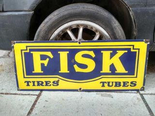 Fisk Tires Tubes Porcelain Enamel Sign 30x12 Inches Single Sided