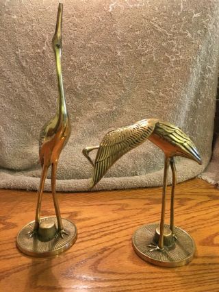 Two Brass Heron Cranes One Standing Stretching,  Other Cleaning Under Its Wing