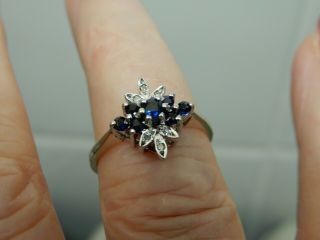A Stunning 9 Ct Gold Blue Sapphire And Diamond Cluster Ring
