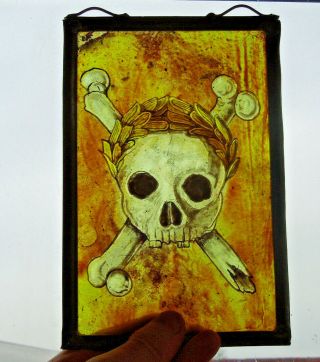 Victorian Stained Glass Fragment Of A Skull And Crossbones.