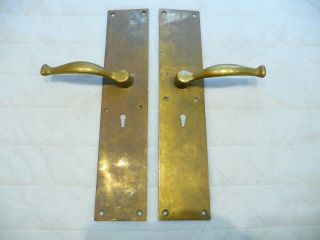 Antique Brass Lever Door Handles On Brass Finger Plates With Key Hole