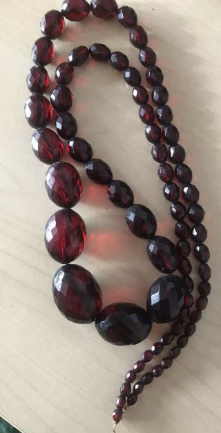 Art Deco Long Cherry Amber Bakelite Faceted Graduating Bead Necklace 82.  7gms