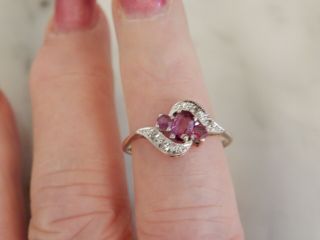 A Vintage 9 Ct Gold Oval Ruby And Diamond Cluster Ring