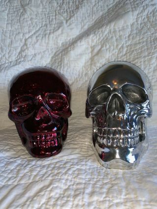 2 Life Size Skull Heads 1 Chrome & 1 Red Glass