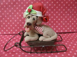 Handsculpted Weimaraner Dog On Christmas Sled Figurine