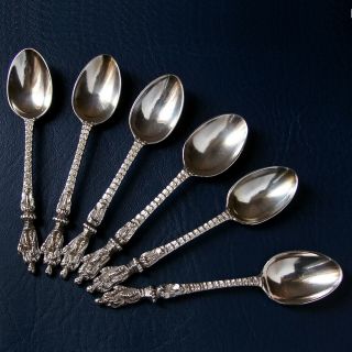A very ornate set of 6 antique Victorian solid silver tea spoons.  London 1868 HH 2