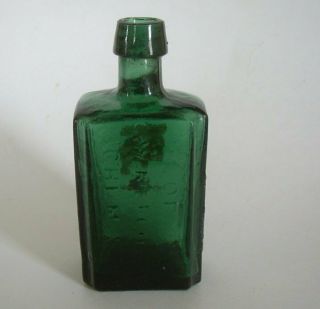 Old Teal Bottle From The Laboratory Of C.  W.  Merchant Chemist Lockport Ny