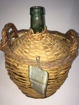Antique French Green Glass Demijohn Wine Bottle In Basket 16”,  Tall W/ Metal Tag