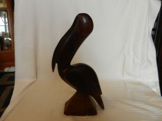 Carved Wooden Pelican Figurine,  Mahogany Tone,  Sitting On Rock