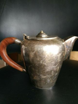 An Art Deco Solid Silver Teapot With Wooden Handle