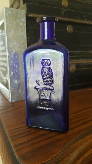 The Owl Drug Co.  Cobalt Blue Poison One Wing 6 " Tall
