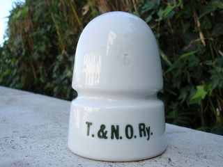 - T.  & N.  O.  Ry Skirt Stamped White Porcelain Beehive Railroad Insulator
