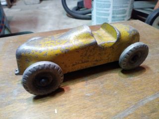 Circa 1930 ' s vintage metal cast toy car,  worn yellow,  racer style. 2