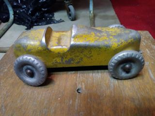 Circa 1930 ' s vintage metal cast toy car,  worn yellow,  racer style. 3