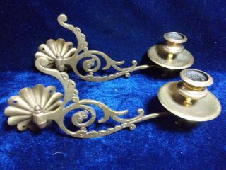 A Ornate Brass Swivel Candle Holders.