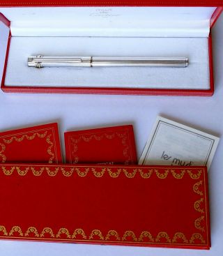 Must De Cartier Trinity Ring Rollerball Pen And Papers